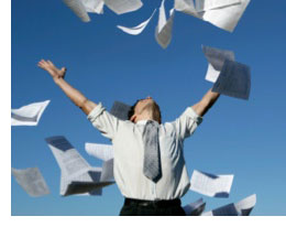 Man tossing papers in the air